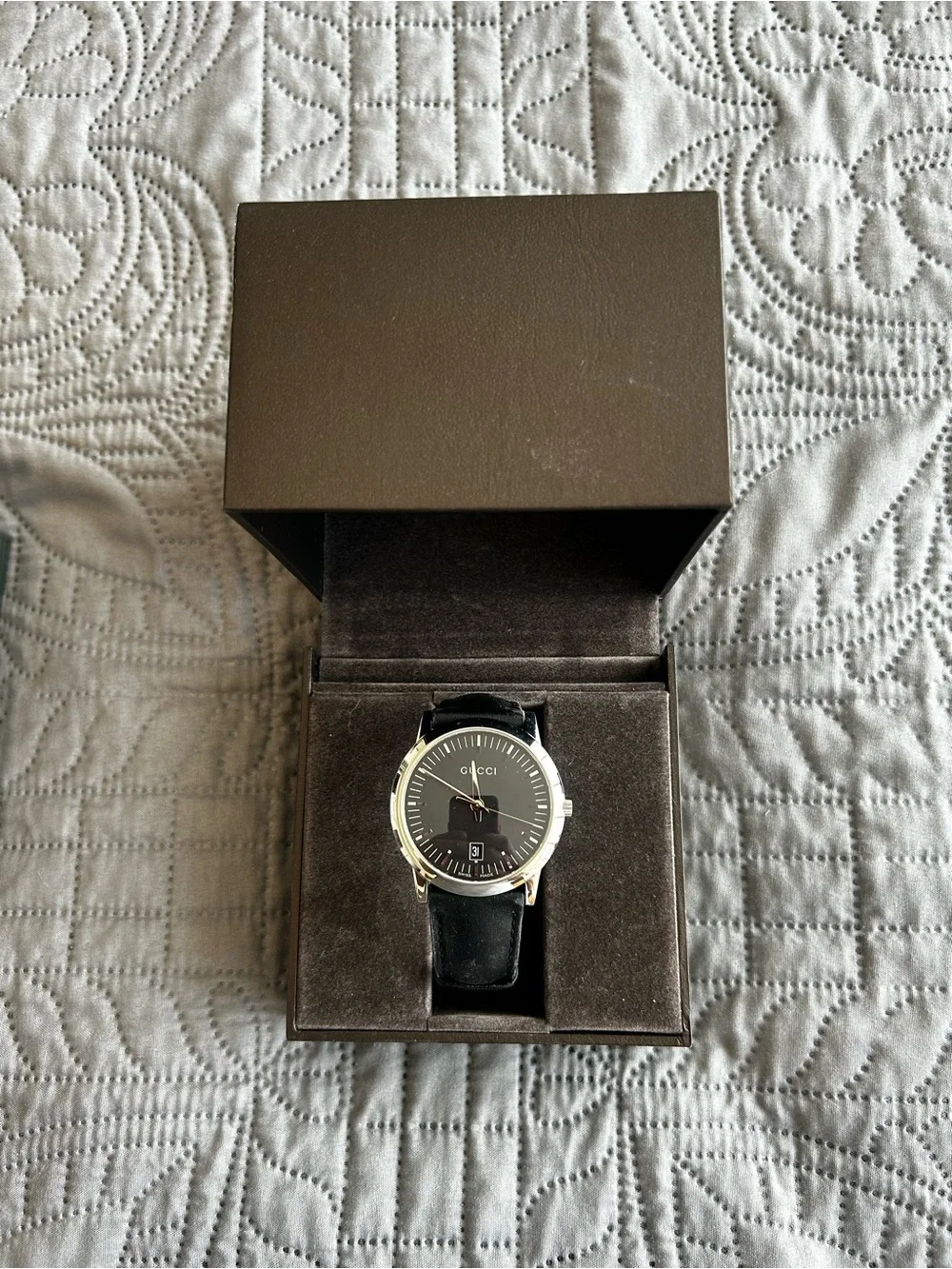 Gucci Men's Silver Wristwatch With Black Leather Strap.